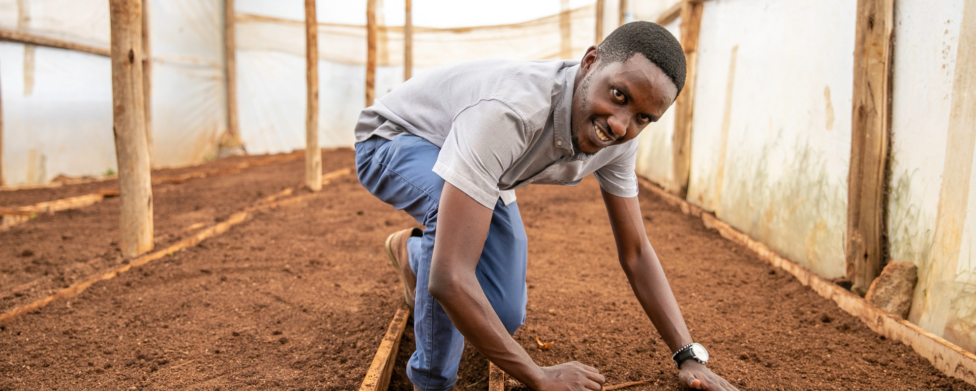 Youth entrepreneur working on farm supported through BRIDGE-in Agriculture
